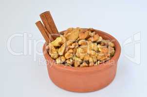 cinnamon and walnuts in clay  bowl