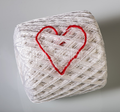 knitted red heart on white