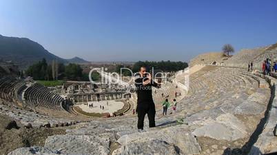 tourist taking photo in amphitheather