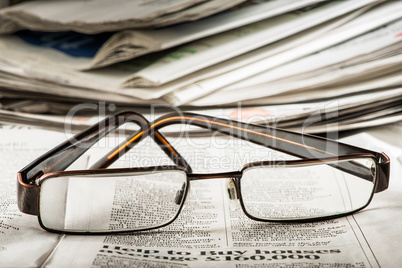 glasses on newspaper