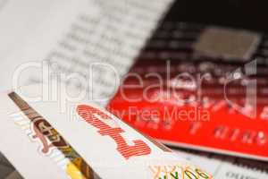credit cards and banknotes on newspaper