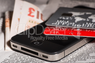 credit cards, mobile phone and banknotes