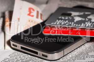 credit cards, mobile phone and banknotes