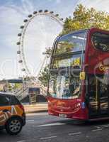 bus on london street and the london eye