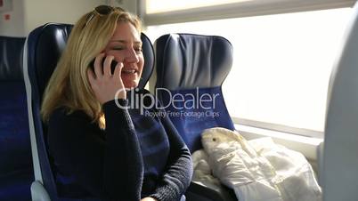passenger talking phone in train