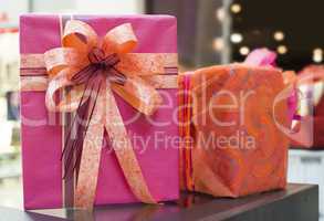 pink and red gift boxes in shopping center