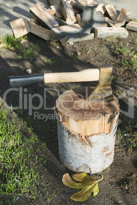ax chopping wood on chopping block