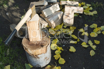 ax chopping wood on chopping block