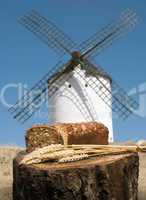 different breads and windmill in the background