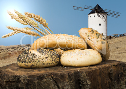 different breads and windmill in the background