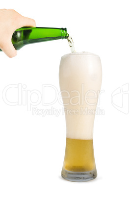 hand holding bottle of beer and beer mug