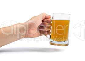 hand holding bottle of beer and beer mug