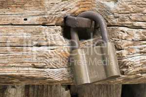 old rotten board with padlock