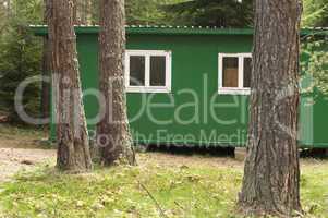 green bungalow in the forest