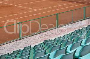 grandstand seats and tennis court