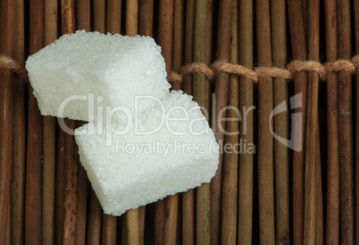 sugar lumps on wooden base
