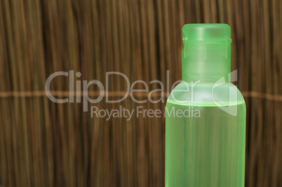 green transparent cosmetic bottle