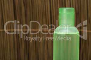 green transparent cosmetic bottle