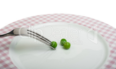 plate with peas and centimeter measure