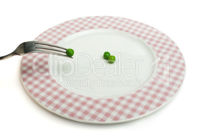 plate with peas and centimeter measure