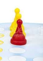 red and yellow game pawns white isolated