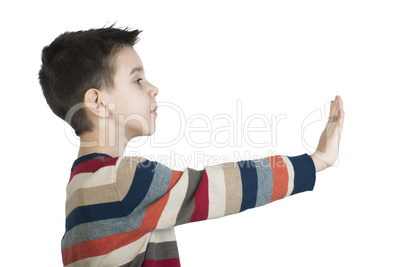 child showing stop symbol