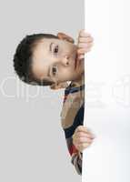 little boy holding a whiteboard