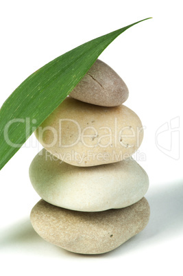 stacked stones and green leafs