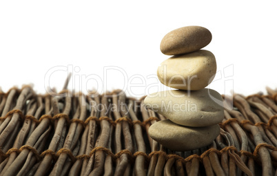 stacked stones on wooden base