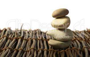 stacked stones on wooden base