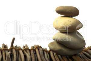 stacked stones on wooden base