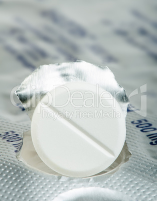 white pill in a pack very close up
