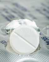 white pill in a pack very close up