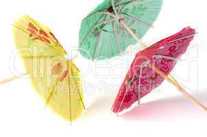 colorful cocktail umbrellas white isolated