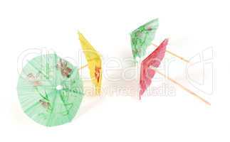 colorful cocktail umbrellas white isolated