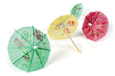 colorful cocktail umbrellas white isolated