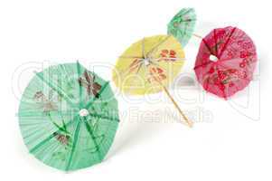 colorful cocktail umbrellas white isolated