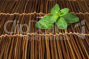 mint leaves on wooden base