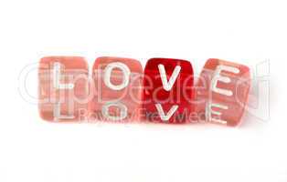 word love on multicolored cubes