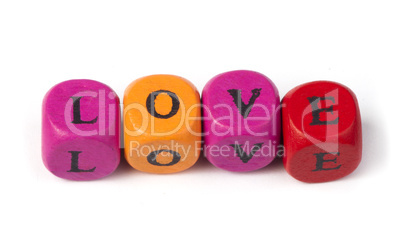 word love on multicolored wooden cubes