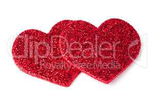 red shiny hearts on white background