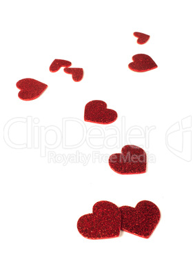 red shiny hearts on white background