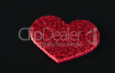 red shiny hearts on black background
