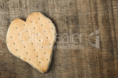 heart shape cookie on wooden background