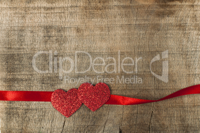 red ribbon tape and two hearts