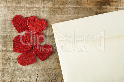 red hearts and white envelope