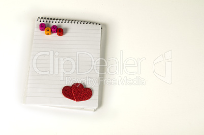 red hearts and white paper sheet