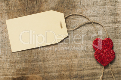 paper label with rope and red hearts