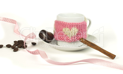 cup of coffee with knitted heart symbol