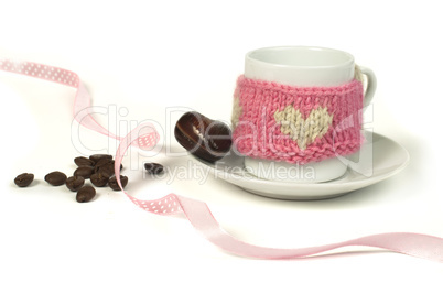 cup of coffee with knitted heart symbol